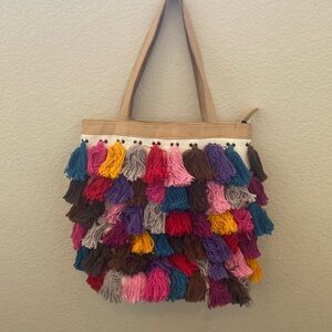 Noonday Collection La Gloria Tote Bag. Multi colored tassels. Full zip.